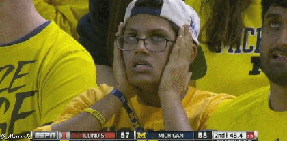 Michigan-Basketball-Fan-Puts-Hands-on-Face.gif