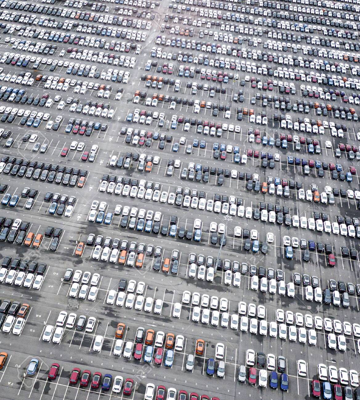 143593118-rows-of-new-cars-in-the-parking-lot-aerial-view-of-large-parking-lot-full-of-cars-of-various-colors.jpg